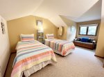 Third level lofted bedroom with two twin beds